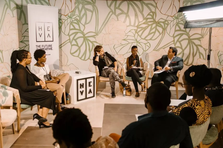 people in room in seated discussion