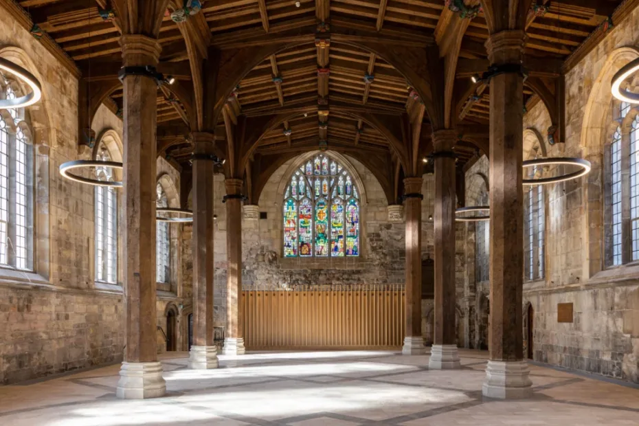 inside view of old church with wood roof and pillars