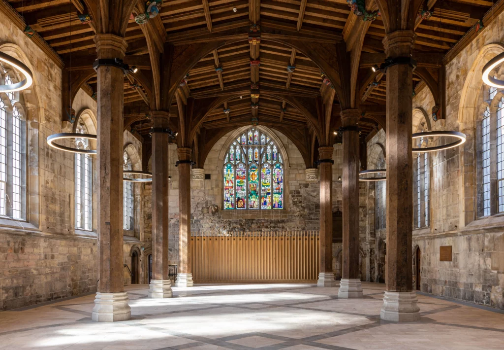 inside view of old church with wood roof and pillars