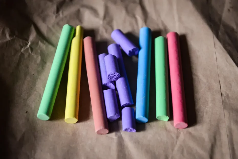 pieces of coloured chalk on brown paper